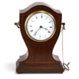 An Edwardian mahogany cased mantle clock, the white enamel dial with Roman numerals, 22cms (8.