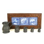 Three Delft style blue & white tiles, framed as one, 59cms (23.25ins) wide; together with a set of