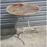A white painted cast iron garden tripod table, 79cms (31ins) diameter.