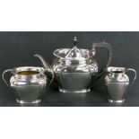 An Arts & Crafts Romney plate three-piece silver plated teaset.