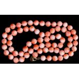 A coral bead necklace with 9ct gold clasp, 46cms (18ins) long. overall weight 20.3g