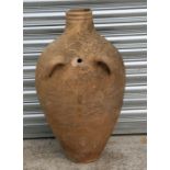 A large two-handled terracotta jar, 73cms (28.5ins) high.