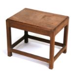 A Cotswold School style elm stool, 47cms (18.5ins) wide.