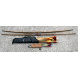 Two archery bows, arrows and a quiver.