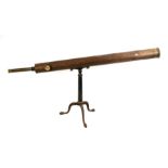 A large late 19th century telescope on triform tripod stand, 125cms (49ins) long.