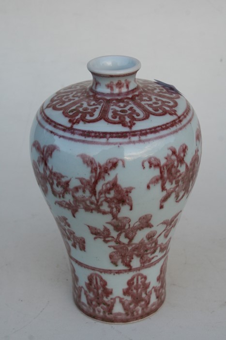 A Chinese underglazed copper red Meiping vase decorated with flowers, 26cms (10.25ins) high. - Image 6 of 7