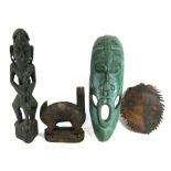 An African carved wooden fertility figure, 51cms (20ins) high; together with other similar