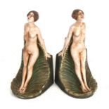 A pair of Art Nouveau painted plaster figural bookends, Compton Pottery style, 21cms (8.25ins)