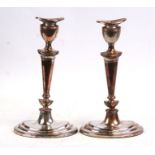 A pair of 19th century silver plated candlesticks, 30cms (12ins) high (2).