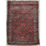 A Caucasian rug with geometric and floral motifs within a multi border, 208.5 by 120.5cms (82 by
