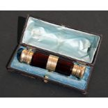 A Victorian silver gilt mounted cranberry glass double ended combination scent bottle and