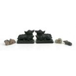 A pair of Chinese soapstone Fo dogs, 13cms (5ins) wide; together with smaller soapstone carvings.