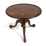 A mahogany occasional table on tripod base, 66cms (26ins) diameter.