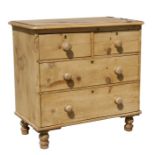 A pine chest of drawers with two short and two long drawers, 83cms (32.5ins) wide.