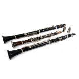 A rosewood clarinet; together with two other similar (3).