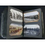 A postcard album containing mainly WWI examples to include 'Tommy's in Trenches'.