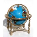 A semi precious stone set terrestrial globe on brass stand. 44cm (17.5 ins)