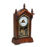 An American architectural simulated rosewood mantle clock, 46cms (18ins) high.