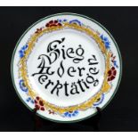 A Russian plate decorated with calligraphy within a foliate border, 27cms (10.5ins) diameter.