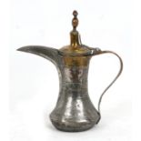 A Turkish or Islamic copper & brass dallah coffee pot, 32cms (12.6ins) high.