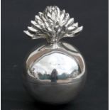 A silver table cigarette lighter in the form of a grenade, crested, marks rubbed, 10cms (4ins)