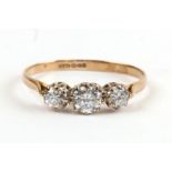 A 9ct gold three-stone ring, approx UK size 'O'.Condition ReportNot diamonds.