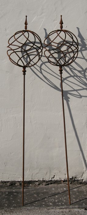 A pair of wrought iron obelisks, each approx 165cms (65ins) high (2).