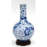 A large Chinese blue & white bottle vase decorated with dragons amongst clouds, six character blue