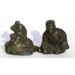Two late 19th century Japanese antimony figures, one a bearded man, the other a figure seated on a