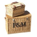 A Fortnum & Mason wicker basket, 68cms (26.5ins) wide; together with another similar, 45cms (17.