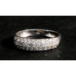 A 9ct white gold dress ring set with three bands of clear stones, approx UK size 'O'.