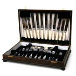 An oak cased canteen containing silver plated cutlery.