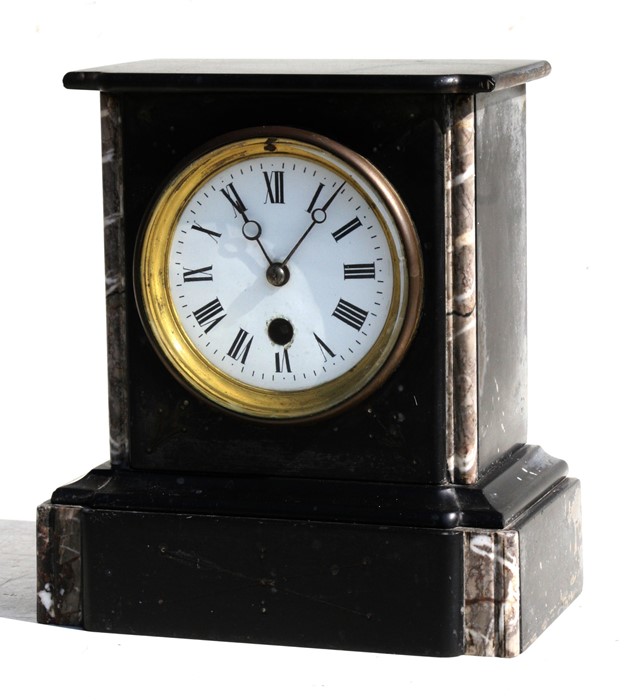 A Victorian black slate mantle clock, having a porcelain dial with Roman numerals, 19cms (7.5ins)