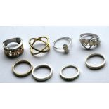 A group of silver dress rings. (8)