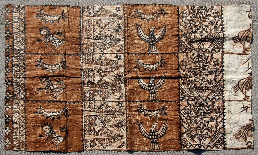 A large Tapa cloth decorated with stylised birds within panels, approx 53 by 78ins.