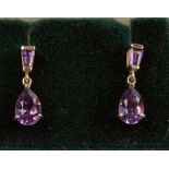 A pair of 9ct gold amethyst drop earrings.