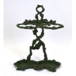 A Victorian painted cast iron two-division stick stand, 48cms (19ins) wide.