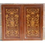 A pair of Edwardian inlaid mahogany door panels, overall 35 by 62cms (13.75 by 24.5ins).