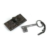 A cast iron fox head desk weight; together with a steel door key.