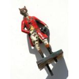 An accessory car mascot in the form of a snooty fox dressed in hunting pink, cold painted, 16cms (