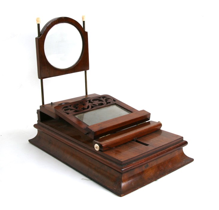 A Victorian figured walnut stereo graphoscope with a pair of stereo lenses, magnifying lens on brass