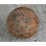 An iron cannon ball, 11cms (4.25ins) diameter.