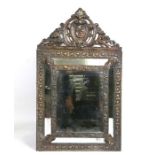 A Dutch pressed brass cushion mirror.Condition ReportMeasurements 55cms high, 32cms wide and 4cms