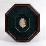 An Italian cameo oval panel depicting Padre Pio, mounted in a box frame, 4.5 by 6cms (1.75 by 2.