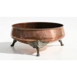 An early 20th century Arts & Crafts Dryad Lester copper bowl with planished decoration, rope twist