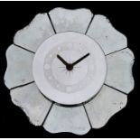A 1960's mirror clock of shaped circular form, 40cms (16ins) diameter.