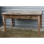A pine farmhouse table with two frieze drawers on tapering square legs, 152cms (60ins) wide.