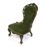 A Victorian walnut nursing chair with upholstered seat button back.Condition ReportStructurally
