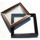 An early 19th century rosewood picture frame, 51 by 39.5cms (20 by 15.5ins); together with a similar