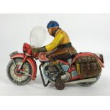 A Tipp & Co (Tippco) post WWII tin plate clockwork motorcycle and rider, manufactured in West